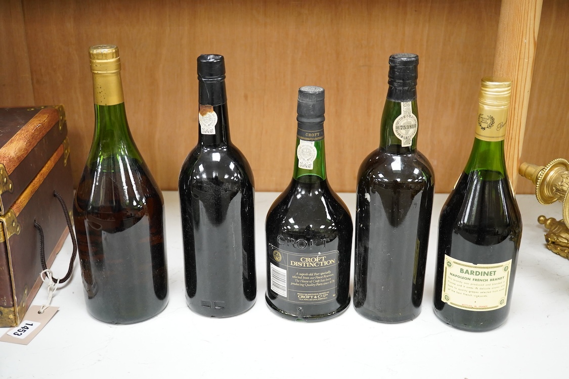 Five bottles of port and brandy, including a bottle of Dow’s 1980 bottle of port